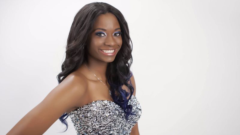 Prom portrait of a young woman in a sequined gown
